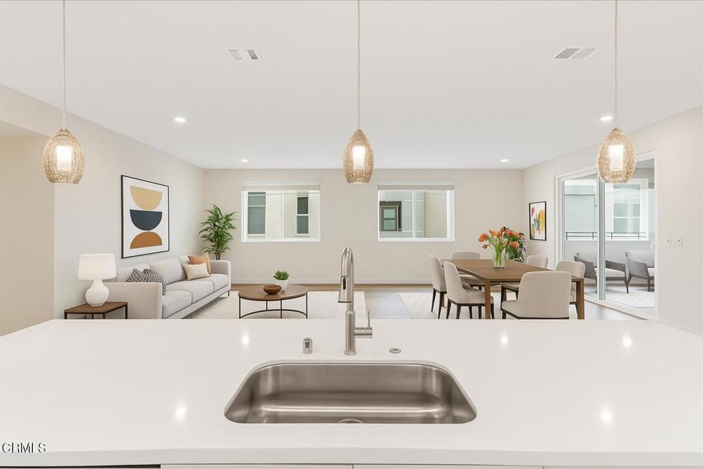 a living room with furniture and a large mirror