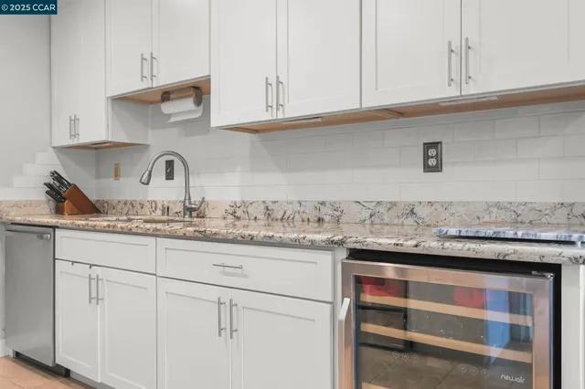 a kitchen with a stove and cabinets