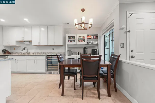 a kitchen with a sink cabinets and window