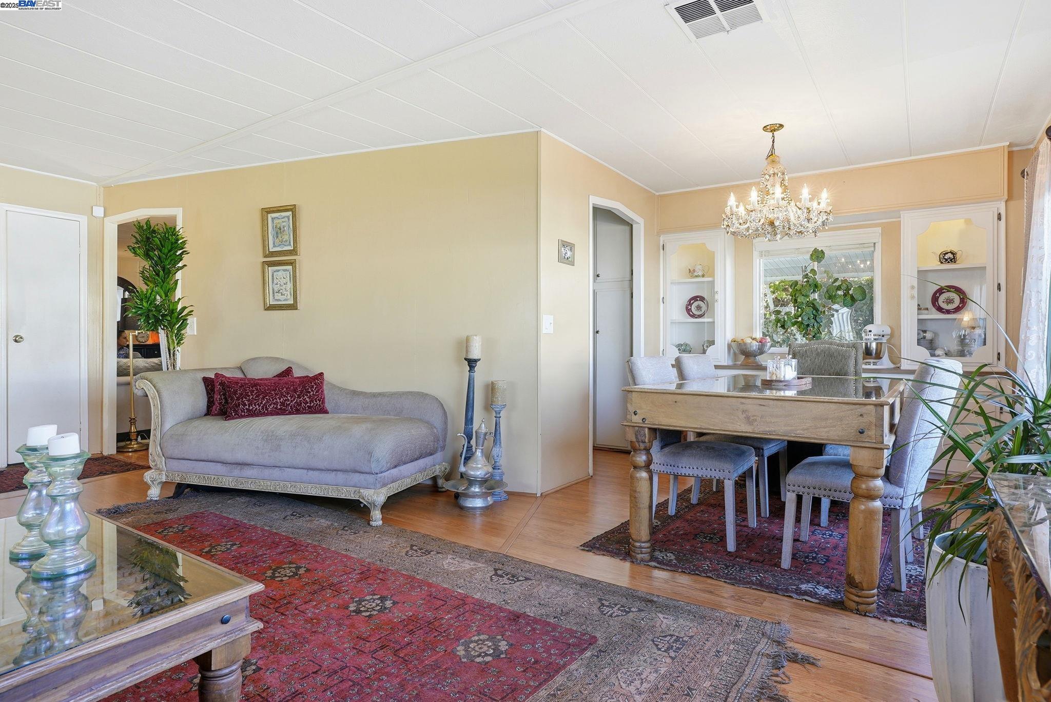 4141 Deep Creek Road, Unit 89 Fremont, CA 94555 - Photo 11 of 54 a living room with furniture and a chandelier