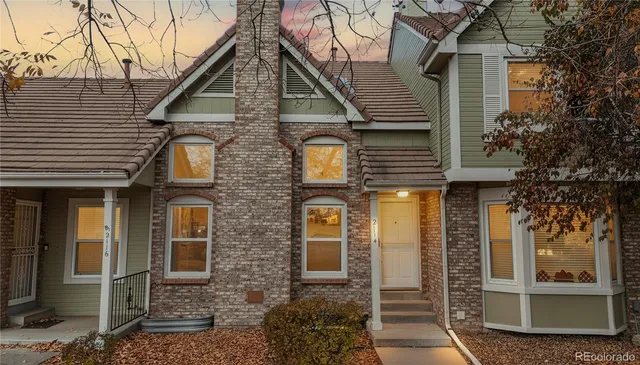 a front view of a house with glass windows