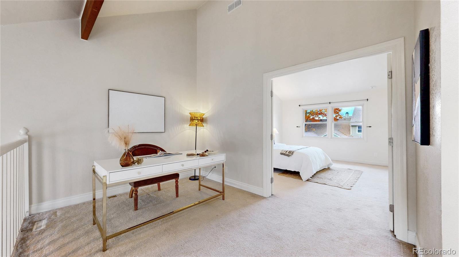 2114 Ranch Drive Denver, CO 80234 - Photo 14 of 48 a living room with furniture and a window