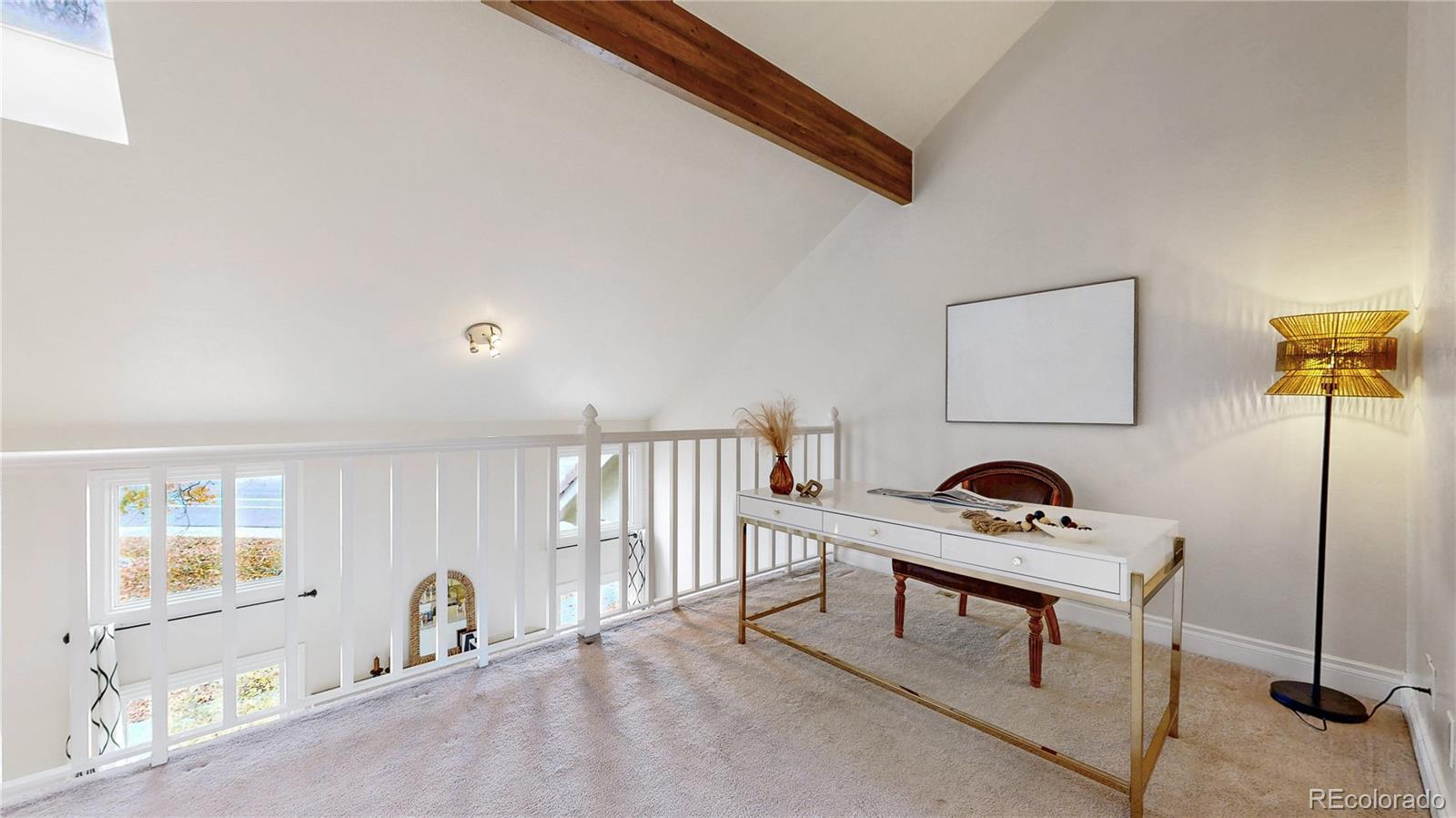 2114 Ranch Drive Denver, CO 80234 - Photo 15 of 48 a living room with furniture and a window