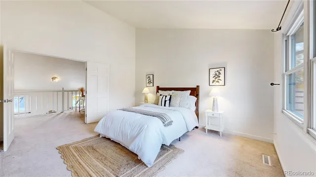 a bedroom with a bed and walk in closet