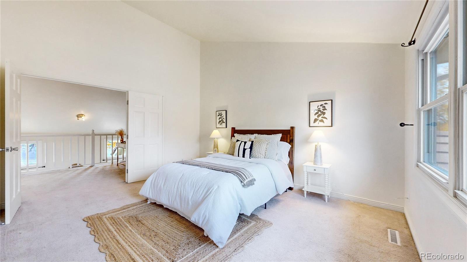 2114 Ranch Drive Denver, CO 80234 - Photo 18 of 48 a bedroom with a bed and walk in closet