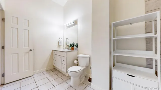 a spacious bathroom with a toilet and a shower