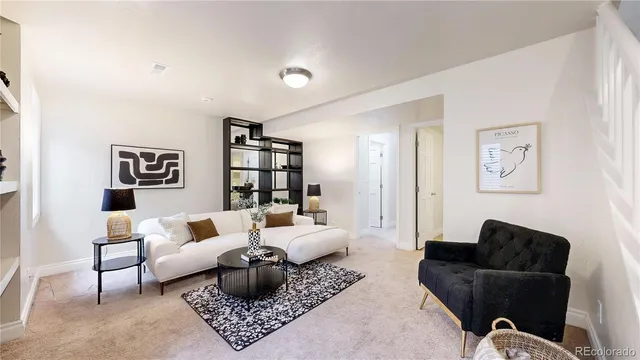 a living room with furniture and a rug