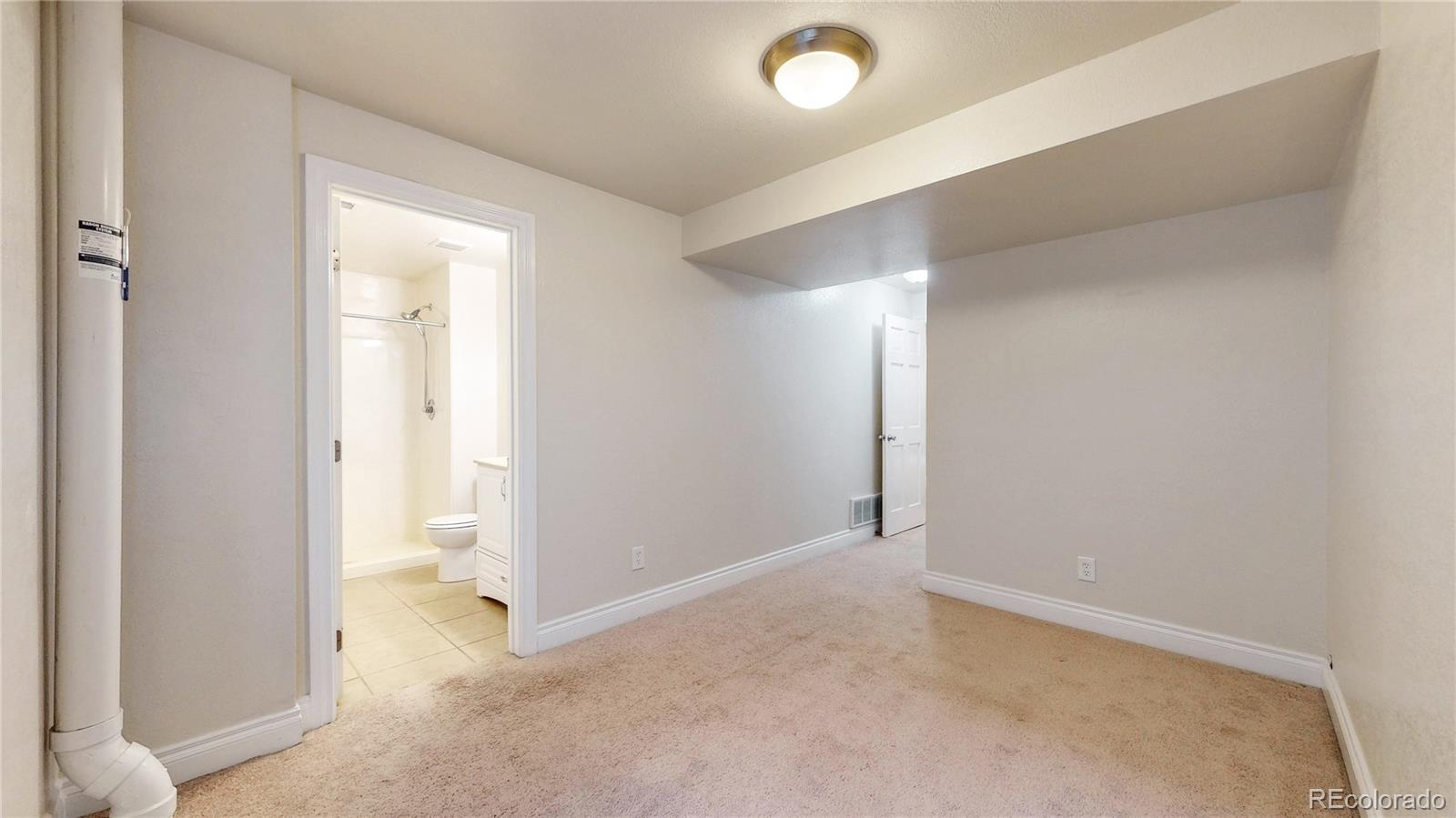 2114 Ranch Drive Denver, CO 80234 - Photo 28 of 48 an empty room with a bathroom