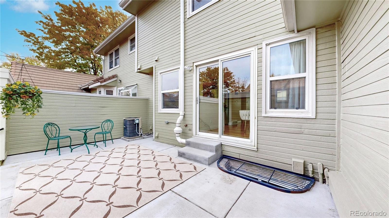 2114 Ranch Drive Denver, CO 80234 - Photo 32 of 48 two chairs and a table in a house