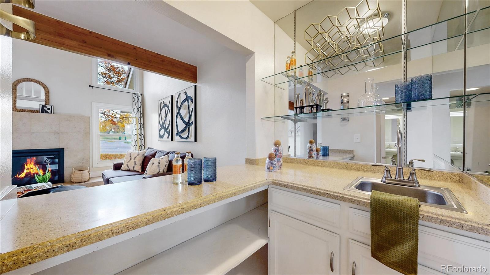 2114 Ranch Drive Denver, CO 80234 - Photo 8 of 48 a kitchen with a sink and a refrigerator