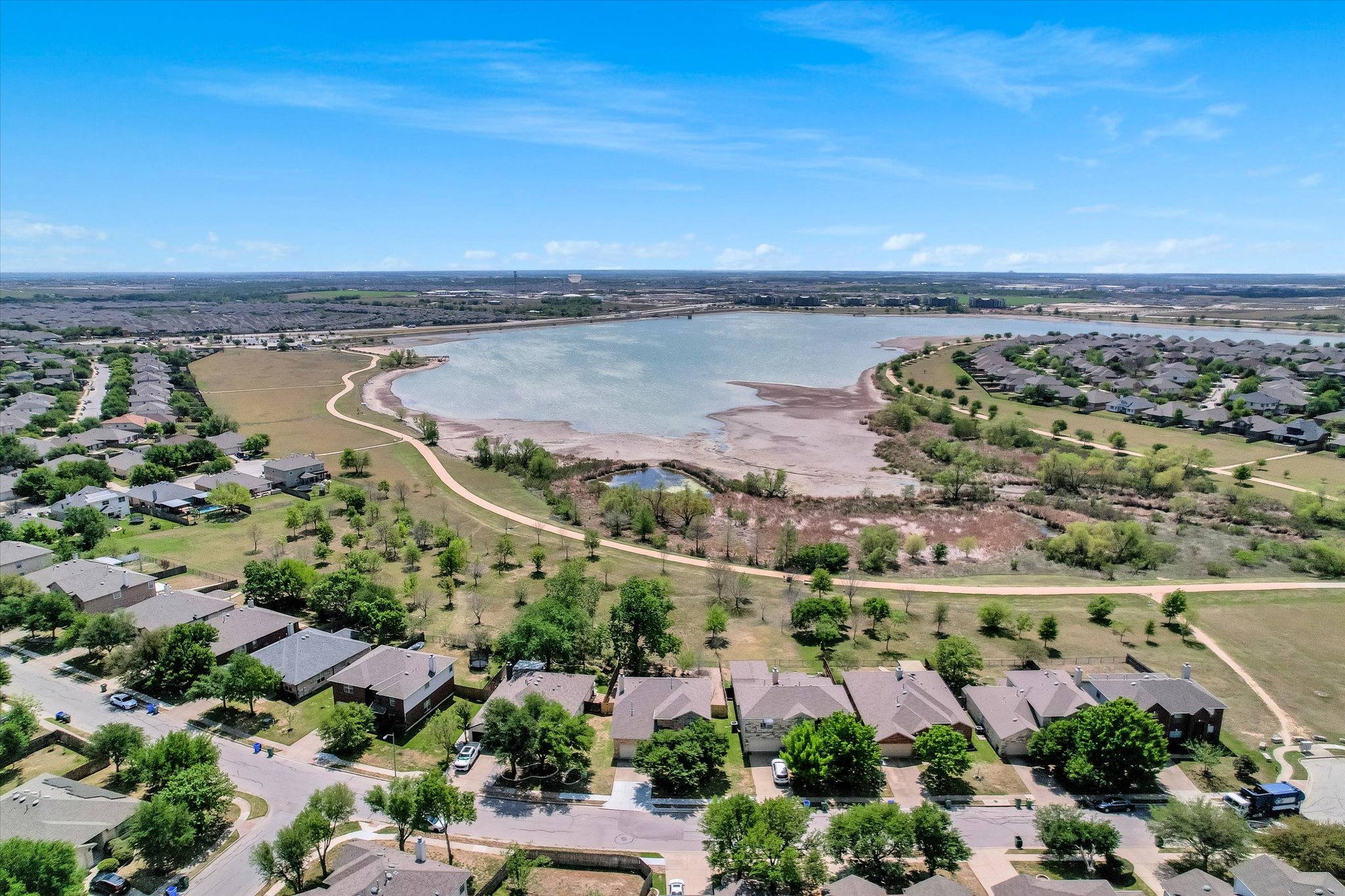 4029 Lake Edge Way Pflugerville, TX 78660 - Photo 28 of 35 Aerial view of residential area featuring a nearby body of water