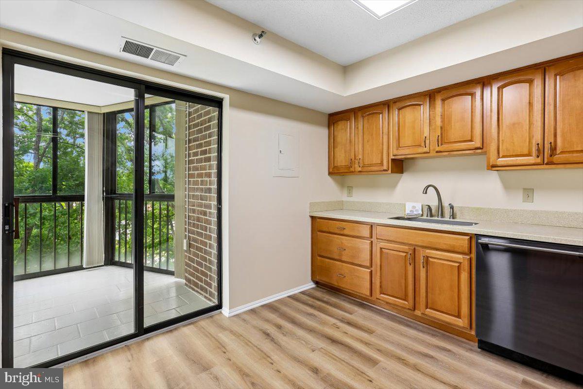 15101 Interlachen Drive, Unit 1614 Silver Spring, MD 20906 - Photo 15 of 41 Kitchen also enters into sunroom