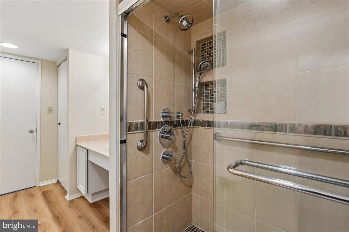 15101 Interlachen Drive, Unit 1614 Silver Spring, MD 20906 - Photo 28 of 41 Hall full bathroom with updated walk in shower