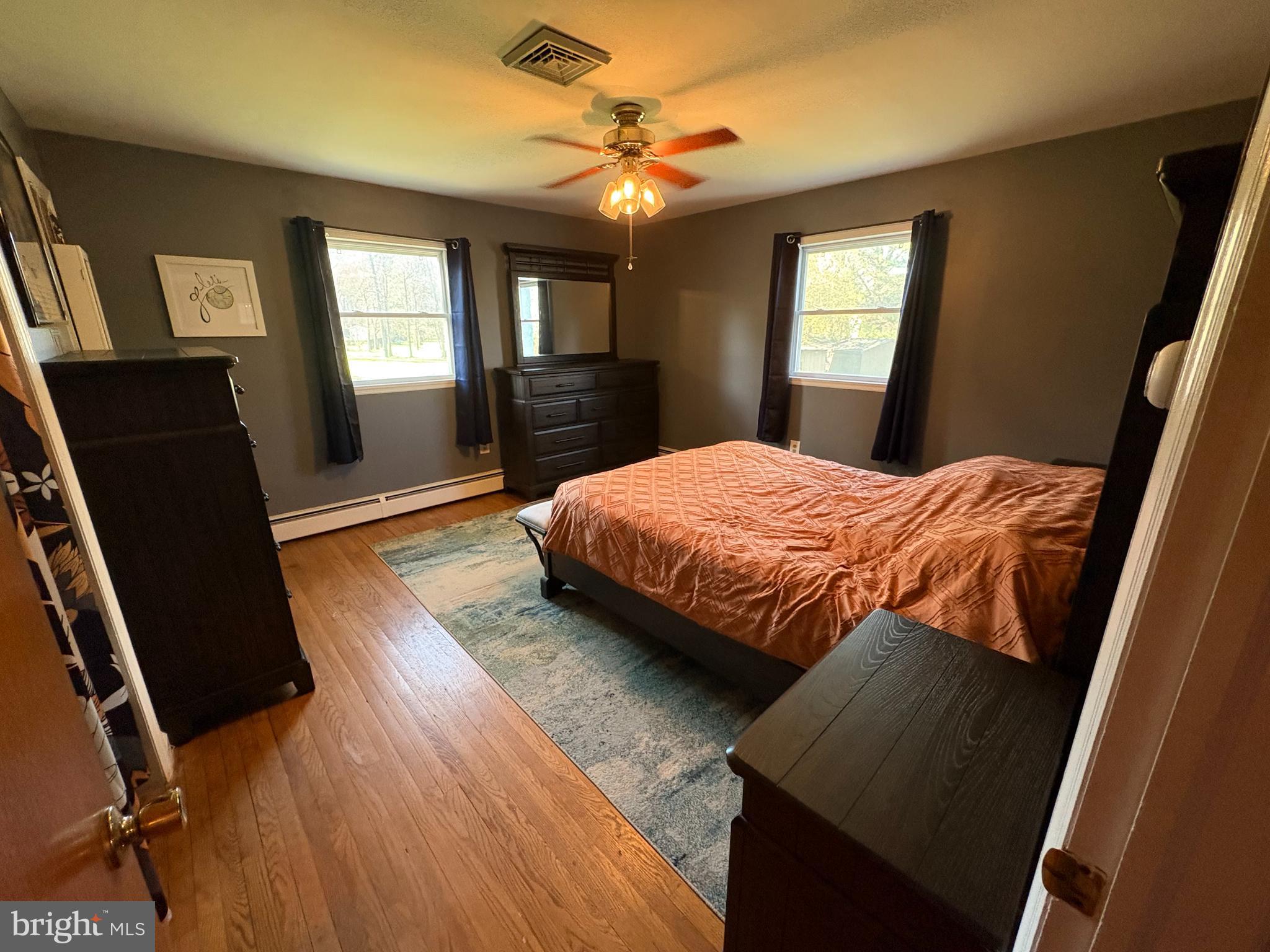 605 Union Mill Road Mount Laurel, NJ 08054 - Photo 10 of 13 a bedroom with a bed a mirror on dresser and a window