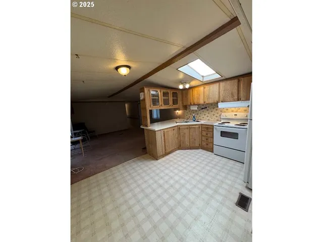 a view of a hallway with washer and dryer