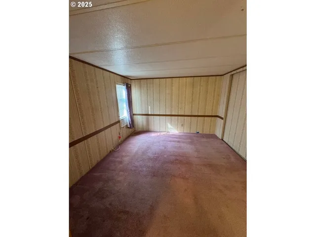 a view of a room with a sink and a window