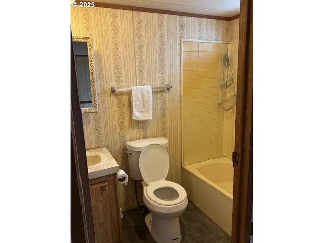a bathroom with a sink and mirror