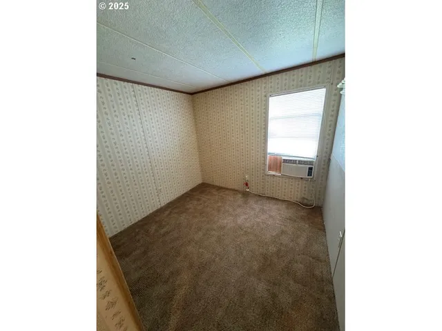 a bathroom with a mirror and shower