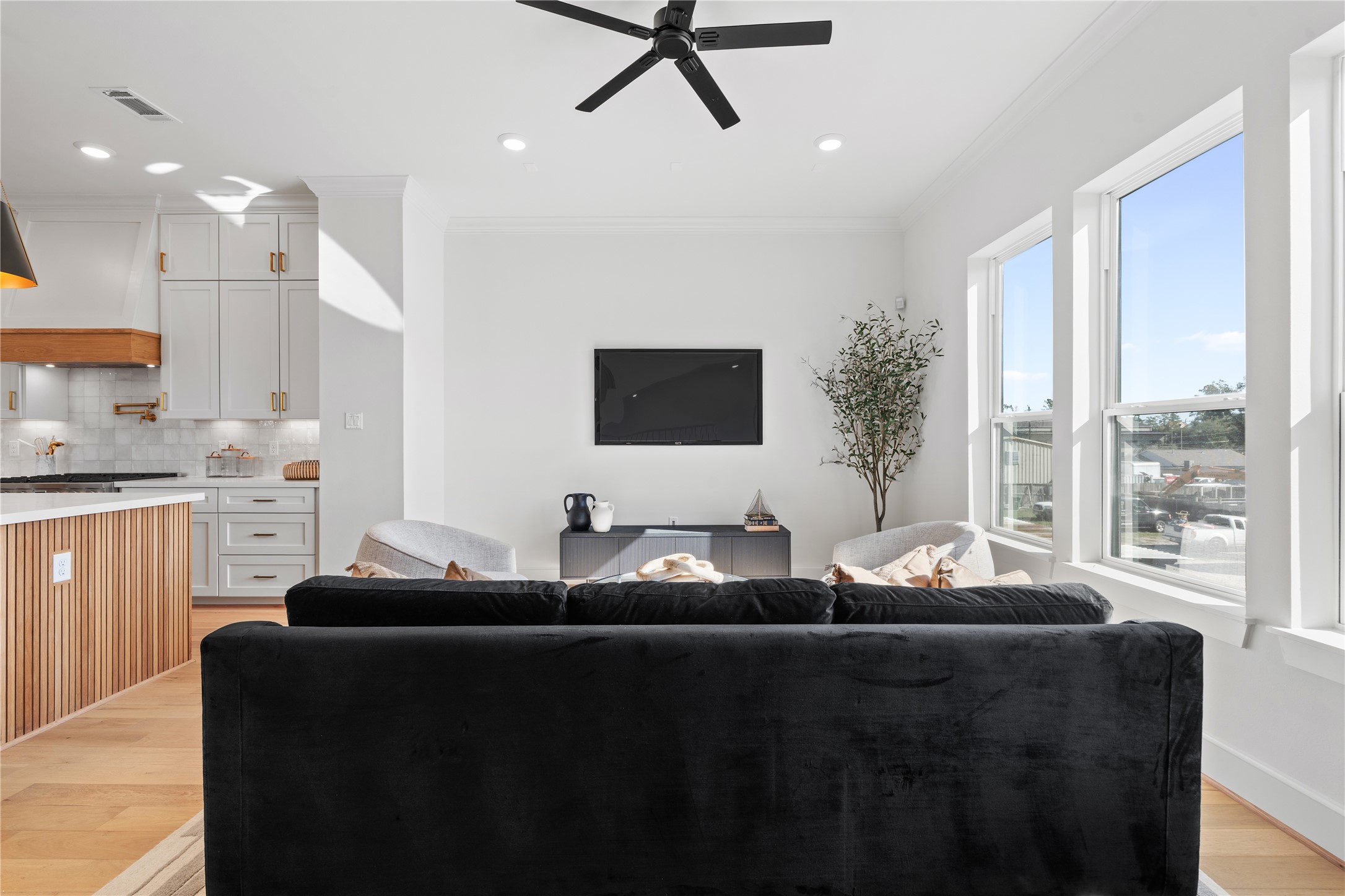 1614 Ojeman Road, Unit I Houston, TX 77055 - Photo 11 of 49 A bright, elegantly styled living space featuring modern decor, soft neutral palettes, and windows that flood the room with natural light.