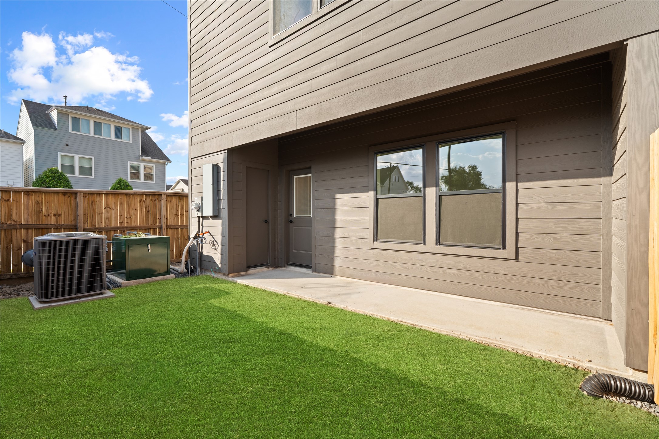 1614 Ojeman Road, Unit I Houston, TX 77055 - Photo 3 of 49 A rare find in the city with a spacious covered backyard featuring an extra storage room - perfect for keeping bikes, holiday décor, or gardening supplies neatly organized while freeing up garage space.