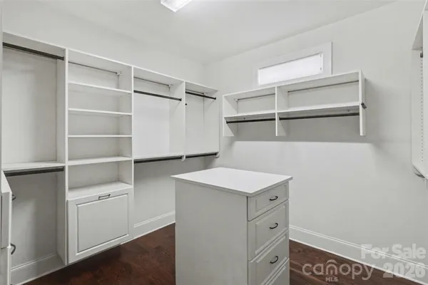 a view of cabinets and wooden floor
