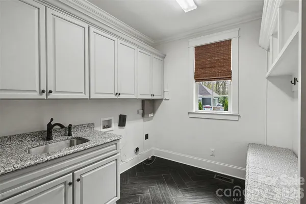 a kitchen with a sink and cabinets