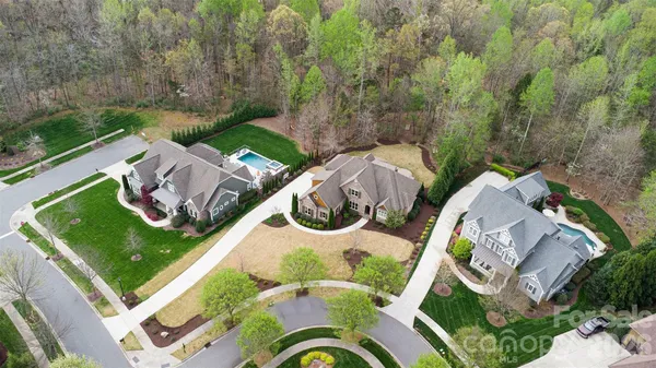 an aerial view of a house with outdoor space