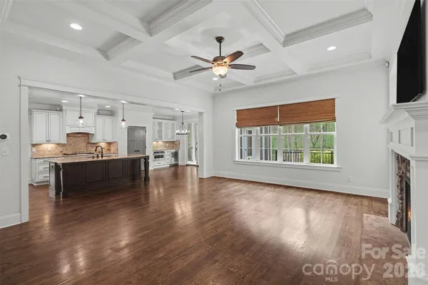 a view of kitchen with sink and wooden floor