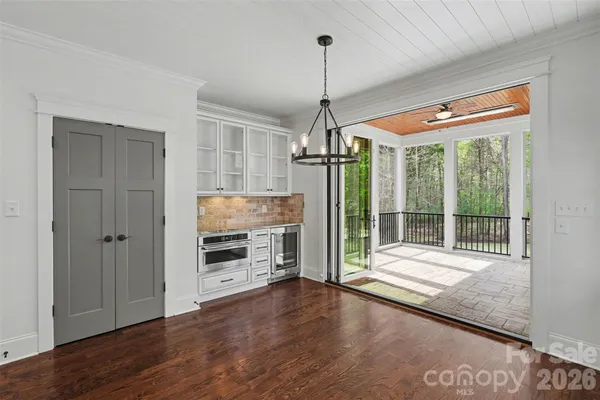 a area with wooden floor and window