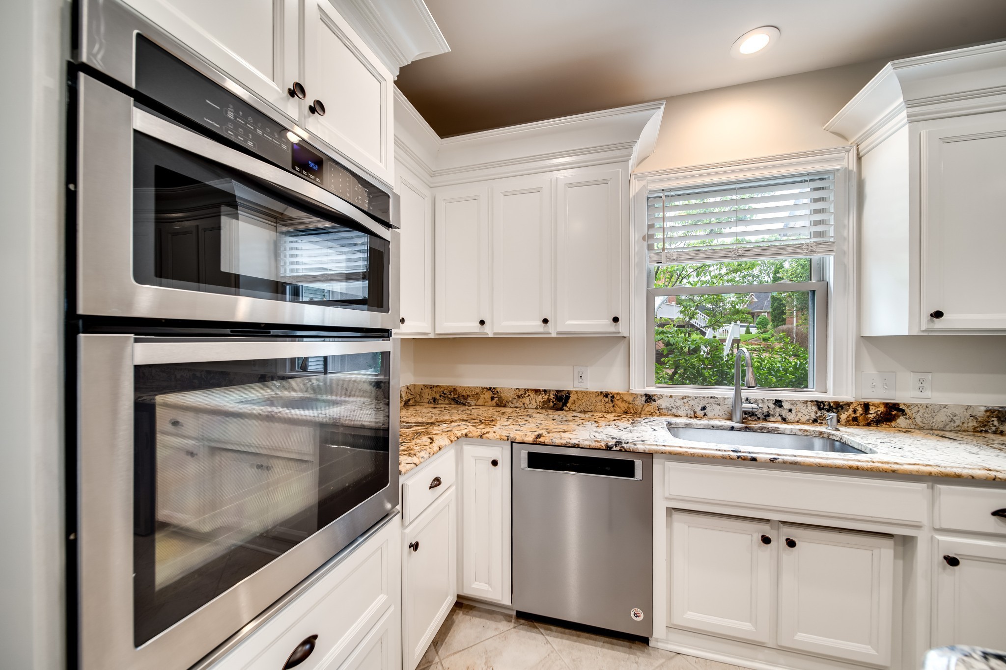 116 Foxcross Road Hendersonville, TN 37075 - Photo 11 of 57 a kitchen with stainless steel appliances granite countertop a stove microwave and sink