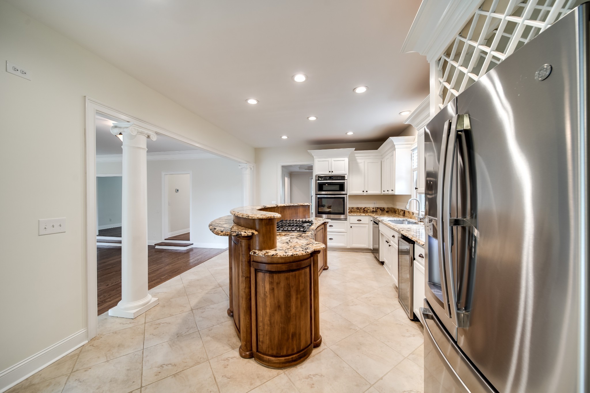 116 Foxcross Road Hendersonville, TN 37075 - Photo 13 of 57 a kitchen with refrigerator and chairs