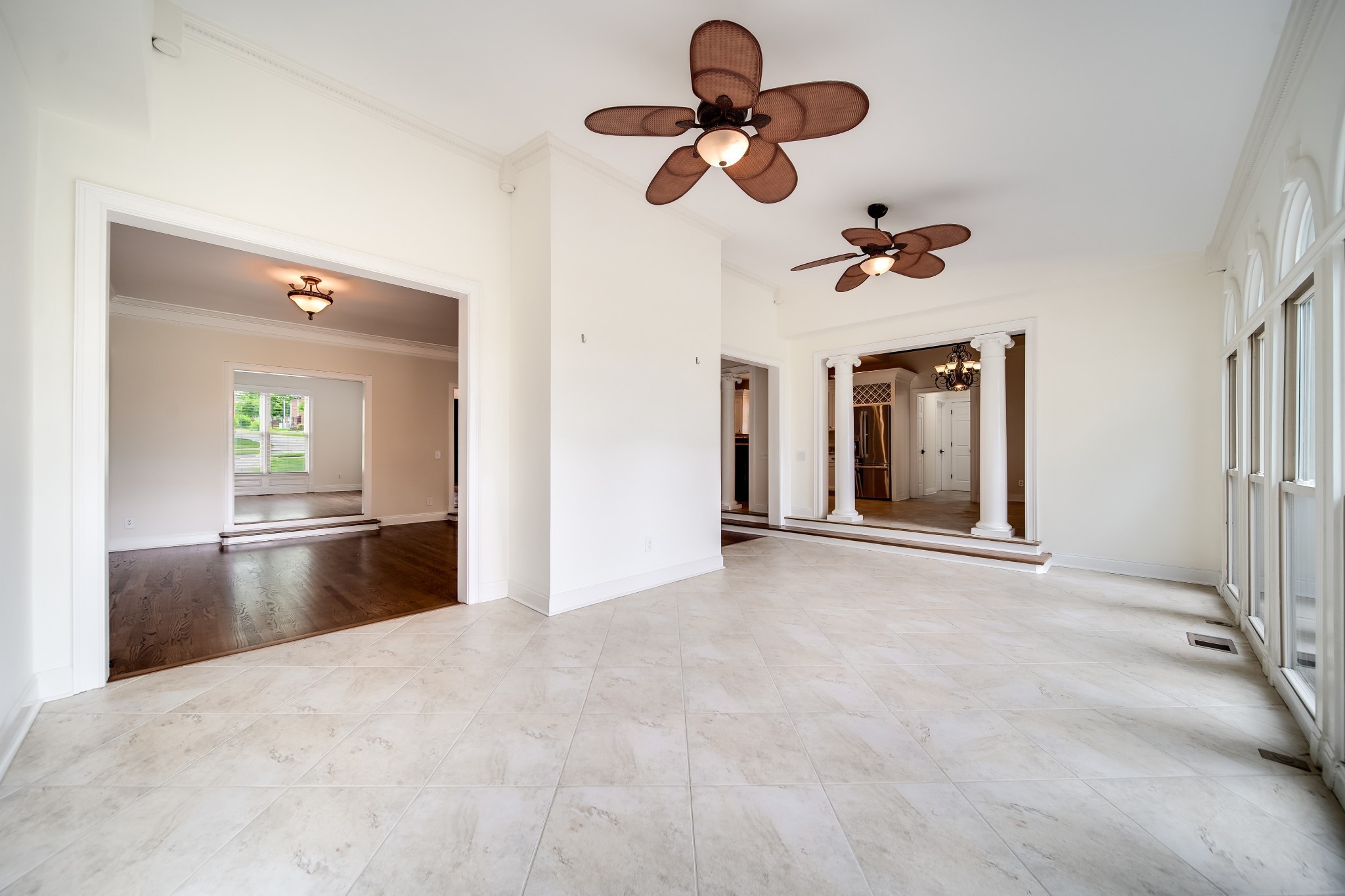 116 Foxcross Road Hendersonville, TN 37075 - Photo 23 of 57 a view of an empty room with a chandelier fan and kitchen view