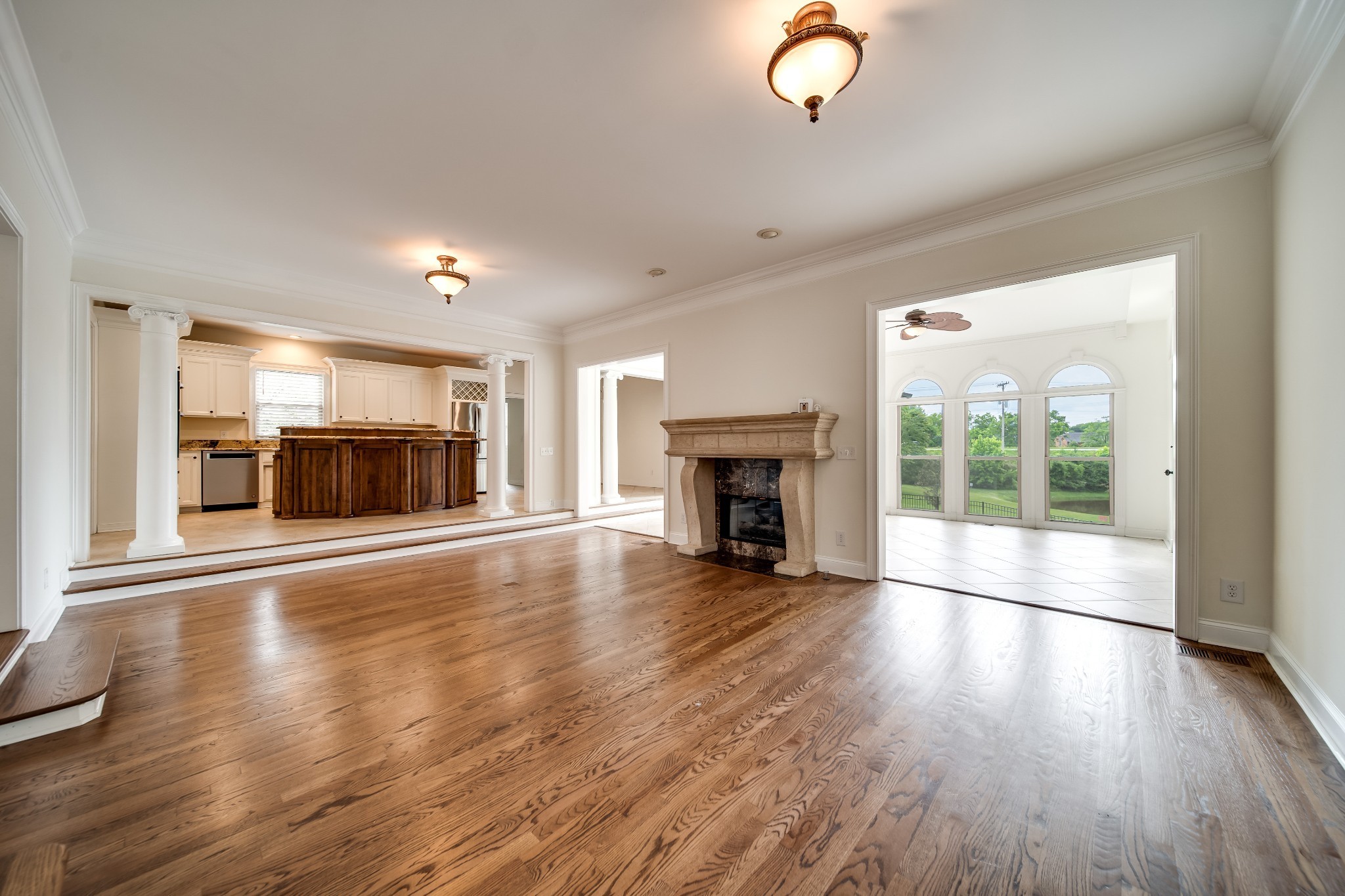 116 Foxcross Road Hendersonville, TN 37075 - Photo 25 of 57 an empty room with wooden floor fireplace and windows