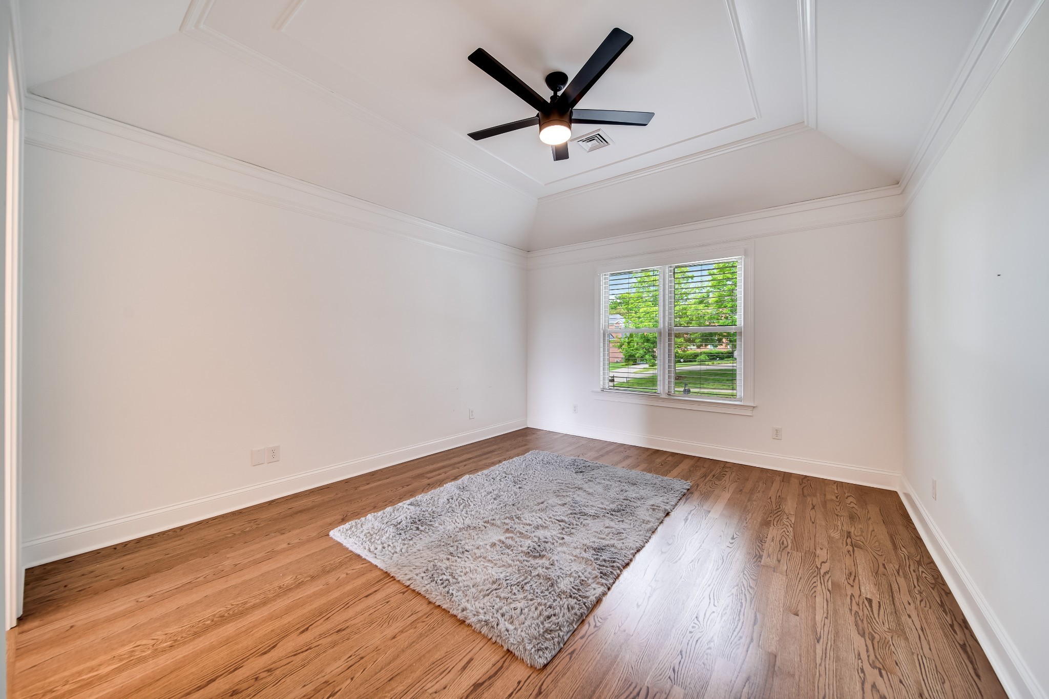116 Foxcross Road Hendersonville, TN 37075 - Photo 36 of 57 an empty room with wooden floor windows and ceiling fan