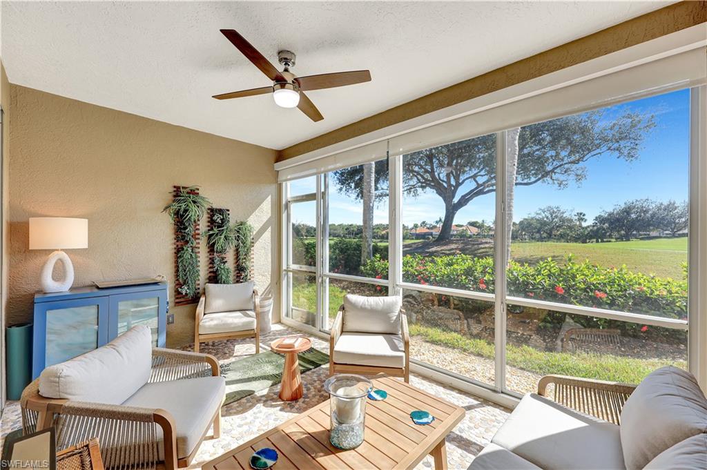 9020 Spring Run Boulevard, Unit 604 Estero, FL 34135 - Photo 20 of 24 a living room with furniture floor to ceiling window and a floor to ceiling window