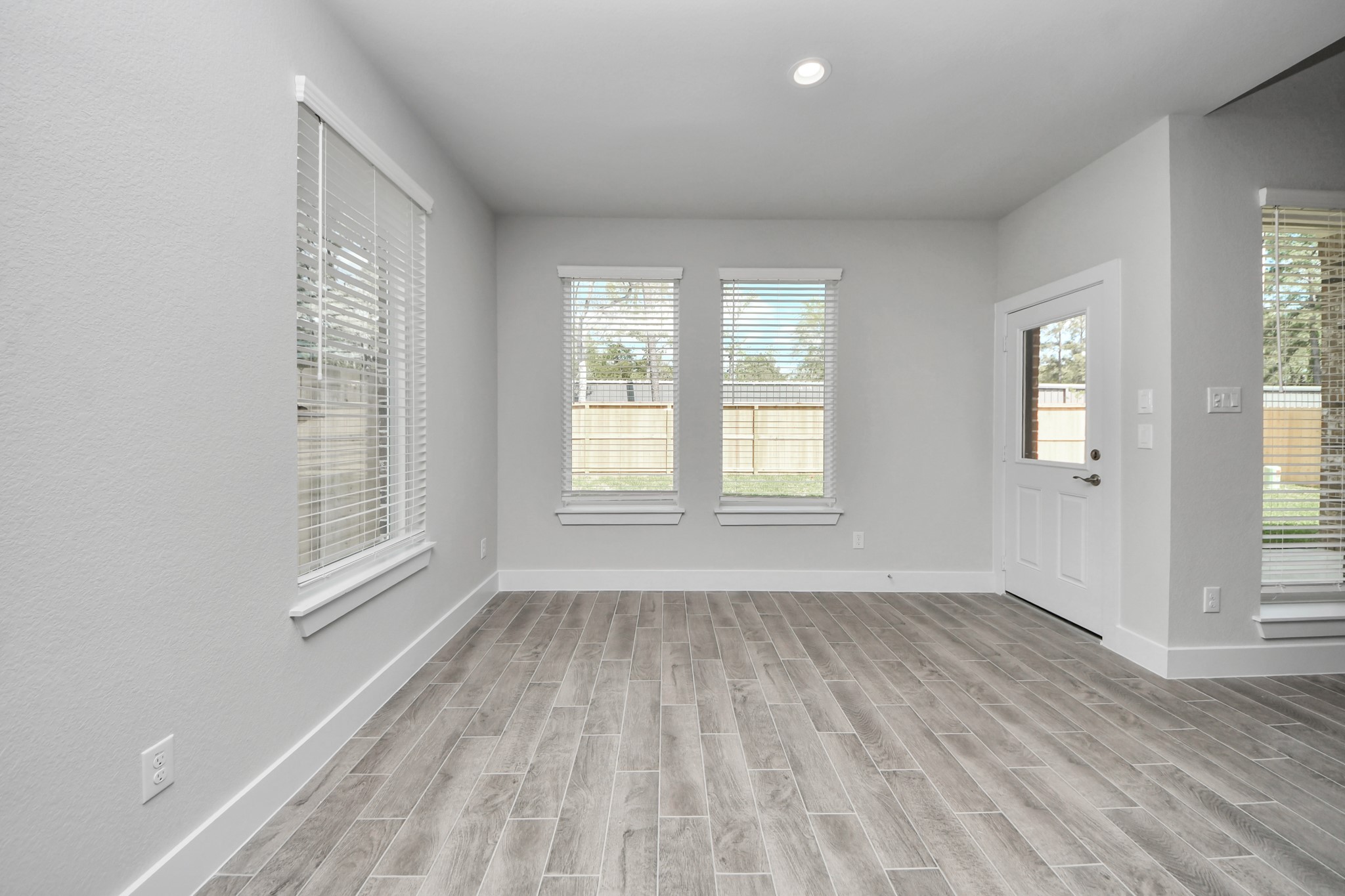 3110 Native Spg Drive Spring, TX 77373 - Photo 12 of 34 Enjoy breakfast with ease in the connected and cozy breakfast area, seamlessly integrated with the kitchen for utmost convenience. Step through the back door for a breath of fresh air onto the covered patio, extending your living space to the outdoors. Sample photo of completed home with similar floor plan. Actual colors and selections may vary.
