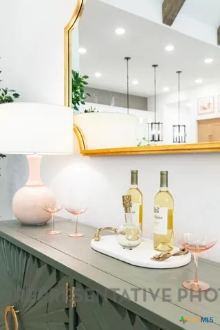a kitchen with stainless steel appliances kitchen island granite countertop a table and chairs