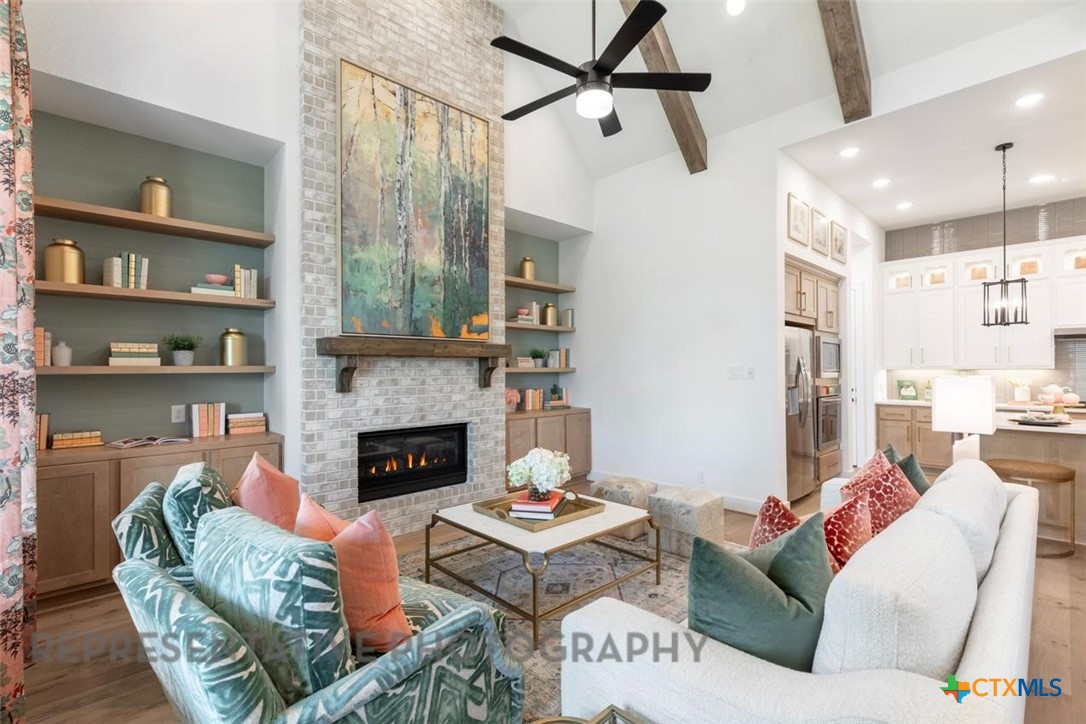 315 Leaning Rock Ridge Austin, TX 78737 - Photo 16 of 40 a living room with furniture and a fireplace