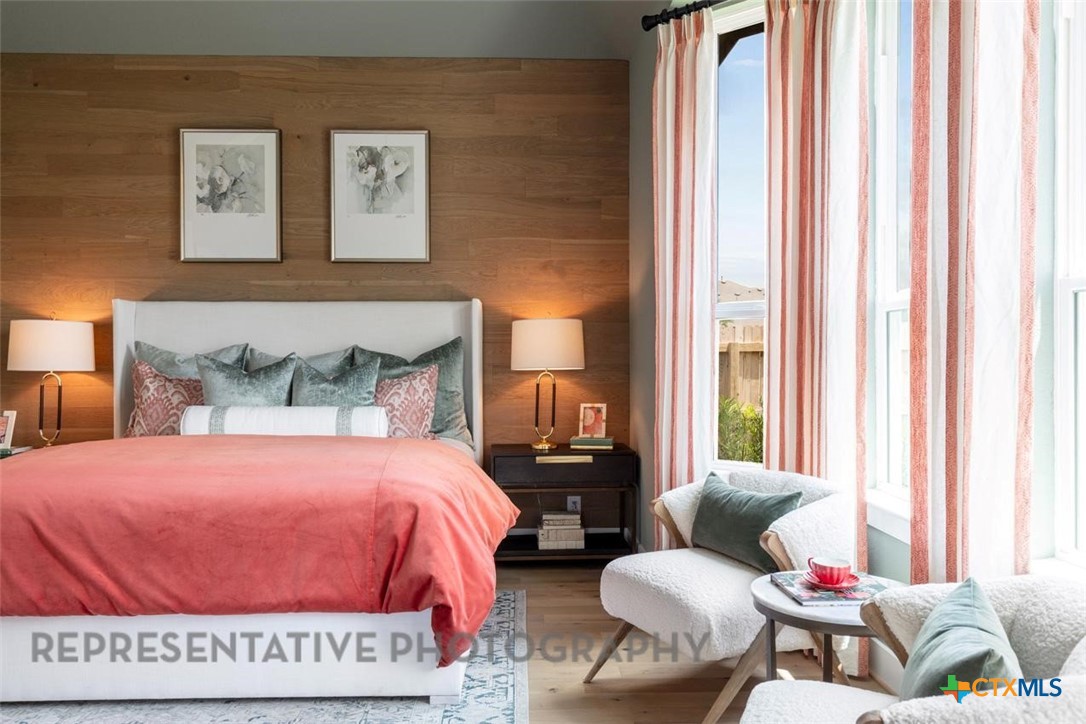 315 Leaning Rock Ridge Austin, TX 78737 - Photo 19 of 40 a bedroom with a bed and wooden floor