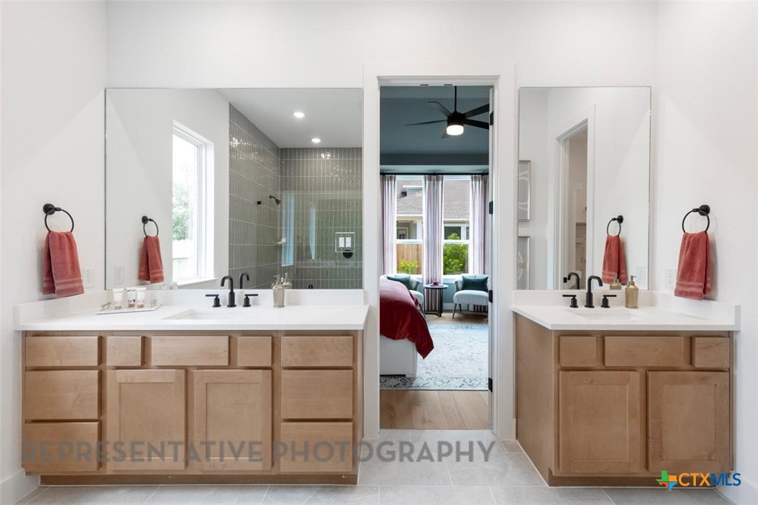 315 Leaning Rock Ridge Austin, TX 78737 - Photo 23 of 40 a en suite bathroom with a double vanity sink