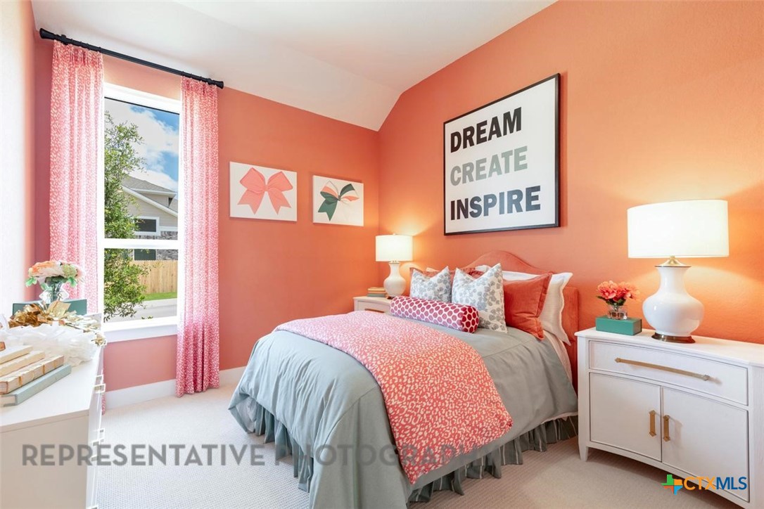 315 Leaning Rock Ridge Austin, TX 78737 - Photo 25 of 40 a bedroom with a bed and a window