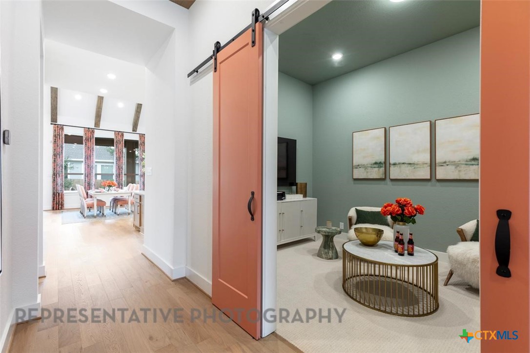 315 Leaning Rock Ridge Austin, TX 78737 - Photo 28 of 40 a hallway with a dining table and chairs