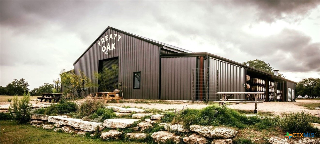 315 Leaning Rock Ridge Austin, TX 78737 - Photo 40 of 40 a backyard of a house with lots of green space