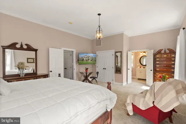 a bedroom with a bed and a mirror