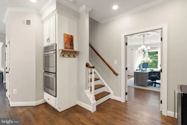 a view of a livingroom with furniture window and wooden floor