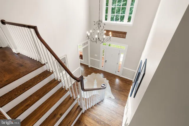 a view of a house with staircase and wooden floor