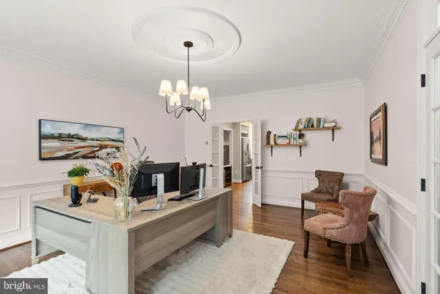a view of a dining room with furniture large windows and wooden floor