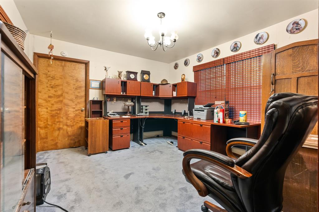 802 North Brazos Street Whitney, TX 76692 - Photo 20 of 33 a room with furniture a chandelier and a window