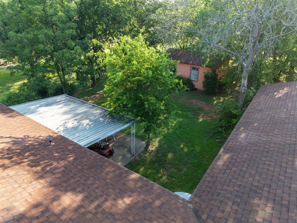 802 North Brazos Street Whitney, TX 76692 - Photo 29 of 33 a view of a yard with potted plants