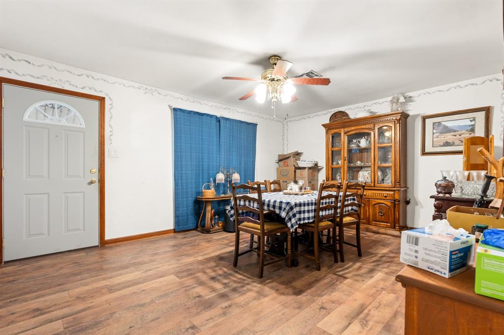 802 North Brazos Street Whitney, TX 76692 - Photo 6 of 33 a view of a dining room with furniture window and wooden floor